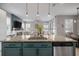 Stylish kitchen with a granite island, stainless steel appliances, and pendant lighting at 8141 Carlton Ridge Dr, Land O Lakes, FL 34638