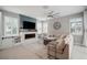 Spacious living room features a fireplace, plantation shutters, modern ceiling fan and comfortable seating at 8141 Carlton Ridge Dr, Land O Lakes, FL 34638