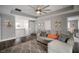 Comfortable living room featuring a plush sectional sofa and lots of natural light at 8141 Carlton Ridge Dr, Land O Lakes, FL 34638
