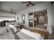 Covered patio featuring comfortable seating, ceiling fans, and access to the home's interior at 8141 Carlton Ridge Dr, Land O Lakes, FL 34638