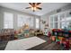 Colorful playroom featuring hardwood floors, large windows, and playful decor for activities at 8141 Carlton Ridge Dr, Land O Lakes, FL 34638