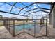 Screened-in pool with safety fence offers a secure and enjoyable outdoor experience at 8141 Carlton Ridge Dr, Land O Lakes, FL 34638