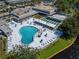 Aerial view of a swimming pool, hot tub, and shuffleboard courts at 8454 111Th St # 201, Seminole, FL 33772