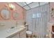 Unique bathroom features a charming vanity, decorative mirrors, and vintage-inspired lighting at 8454 111Th St # 201, Seminole, FL 33772