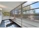 Enclosed Florida room with wall-to-wall windows providing natural light and outdoor views at 8454 111Th St # 201, Seminole, FL 33772