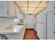 Traditional style kitchen with white cabinets, ample counter space, and modern appliances at 8454 111Th St # 201, Seminole, FL 33772