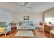 Inviting living room featuring wood floors, comfortable furniture, and a serene ambiance at 8454 111Th St # 201, Seminole, FL 33772