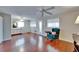 Open living room boasts laminate wood floors, two windows and access to the entry door at 8454 111Th St # 201, Seminole, FL 33772
