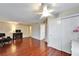 Cozy living room with laminate wood floors, fan and access to a closet and other rooms at 8454 111Th St # 201, Seminole, FL 33772