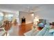 Open floor plan shows a bright living room with hardwood floors, and an adjacent dining area at 8454 111Th St # 201, Seminole, FL 33772