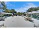 Tables and chairs in a community outdoor recreational area at 8454 111Th St # 201, Seminole, FL 33772