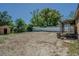 Expansive, low maintenance backyard featuring a covered porch and a shed, perfect for outdoor activities at 8719 N Ola Ave, Tampa, FL 33604