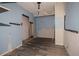 A room with blue walls and new floors at 8719 N Ola Ave, Tampa, FL 33604