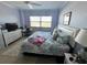 Bedroom with fan, dresser, desk and nautical-themed comforter at 880 Mandalay Ave # S514, Clearwater Beach, FL 33767
