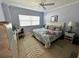 Comfortable bedroom with a queen-sized bed, desk, and ample natural light, creating a relaxing atmosphere at 880 Mandalay Ave # S514, Clearwater Beach, FL 33767