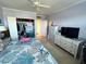 Bedroom with TV, fan, nautical bedding and closet with open doors at 880 Mandalay Ave # S514, Clearwater Beach, FL 33767