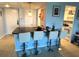 Kitchen featuring white stools and a black countertop at 880 Mandalay Ave # S514, Clearwater Beach, FL 33767