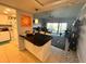 Cozy kitchen opening to a living room with a waterfront view at 880 Mandalay Ave # S514, Clearwater Beach, FL 33767