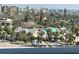 Charming neighborhood with a mix of colorful houses, palm trees, and distant water views at 880 Mandalay Ave # S514, Clearwater Beach, FL 33767