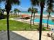 Beautiful pool area featuring lush landscaping, a charming gazebo, and scenic views of the beach and ocean at 880 Mandalay Ave # S514, Clearwater Beach, FL 33767