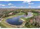 Scenic aerial view of the golf course and lake in this community surrounded by mature trees and beautiful residences at 9314 Heritage Oak Ct, Tampa, FL 33647