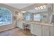 Luxurious bathroom featuring a double vanity, granite countertops, and ample natural light at 9314 Heritage Oak Ct, Tampa, FL 33647