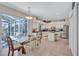 Spacious open kitchen with granite countertops, stainless appliances, white cabinets, island seating, and a breakfast nook at 9314 Heritage Oak Ct, Tampa, FL 33647