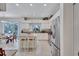 Bright kitchen equipped with stainless steel appliances, granite countertops, a center island, and an adjacent breakfast area at 9314 Heritage Oak Ct, Tampa, FL 33647