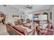 Comfortable living room with leather sofas, tile flooring, ceiling fan and neutral tones at 9314 Heritage Oak Ct, Tampa, FL 33647