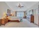 Comfortable main bedroom featuring a ceiling fan, neutral tones, and ample natural light at 9314 Heritage Oak Ct, Tampa, FL 33647