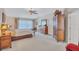 Comfortable main bedroom featuring a ceiling fan, neutral tones, and ample natural light at 9314 Heritage Oak Ct, Tampa, FL 33647