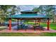 Community pavilion with picnic tables and a large green roof at 9314 Heritage Oak Ct, Tampa, FL 33647