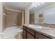 Full bathroom featuring bath tub, tile shower, and granite countertops at 9810 Trumpet Vine Loop, Trinity, FL 34655