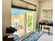 Cozy balcony with sliding glass door, lounge chair, and a view of the surrounding area at 100 Bluff View Dr # 117C, Belleair Bluffs, FL 33770