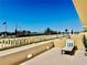 Wide-angle balcony shot, with a single chair, and a panoramic view at 100 Bluff View Dr # 117C, Belleair Bluffs, FL 33770
