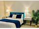 Inviting bedroom with ample natural light, warm tones, and comfortable furnishings at 100 Bluff View Dr # 117C, Belleair Bluffs, FL 33770