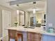 Bright kitchen with counter seating and white countertops at 100 Bluff View Dr # 117C, Belleair Bluffs, FL 33770
