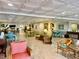 Lobby lounge with seating arrangements, tile floors, and decor at 100 Bluff View Dr # 117C, Belleair Bluffs, FL 33770