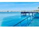 Waterfront view of the pier and sailboats create a serene and picturesque scene enhancing the property's appeal at 100 Bluff View Dr # 117C, Belleair Bluffs, FL 33770