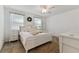 Bright bedroom with neutral decor, carpet flooring, and ample natural light, creating a serene retreat at 1018 Rose Blossom Ct, Tampa, FL 33613