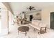 Spacious covered patio with ceiling fans and comfortable seating, offering a relaxing outdoor gathering space at 1018 Rose Blossom Ct, Tampa, FL 33613