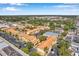 Aerial view featuring convenient parking and storage units, and the complex pool and lush landscaping at 10764 70Th Ave # 6105, Seminole, FL 33772