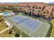 A tennis court with beautiful landscaping at 10764 70Th Ave # 6105, Seminole, FL 33772