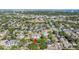 Stunning aerial view of a lush neighborhood near schools and a city skyline, offering a vibrant community atmosphere at 1104 S Lois Ave, Tampa, FL 33629
