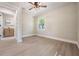 Bright room showcasing wood floors and a modern bathroom with glass shower at 1104 S Lois Ave, Tampa, FL 33629