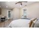 Bedroom with modern décor, ceiling fan, and view into the connected living spaces at 1104 S Lois Ave, Tampa, FL 33629