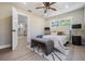 Bedroom with a comfortable bed, bench seating, and view to the kitchen at 1104 S Lois Ave, Tampa, FL 33629