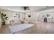 View of the living room with modern furnishings and an open layout leading to the kitchen at 1104 S Lois Ave, Tampa, FL 33629