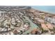 Beautiful aerial view showcasing the beach, inter-coastal waterway, and residential community at 11525 Gulf Blvd # 401, Treasure Island, FL 33706