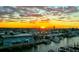Breathtaking aerial view of a sunset over a coastal town with canals and boat docks at 11525 Gulf Blvd # 401, Treasure Island, FL 33706